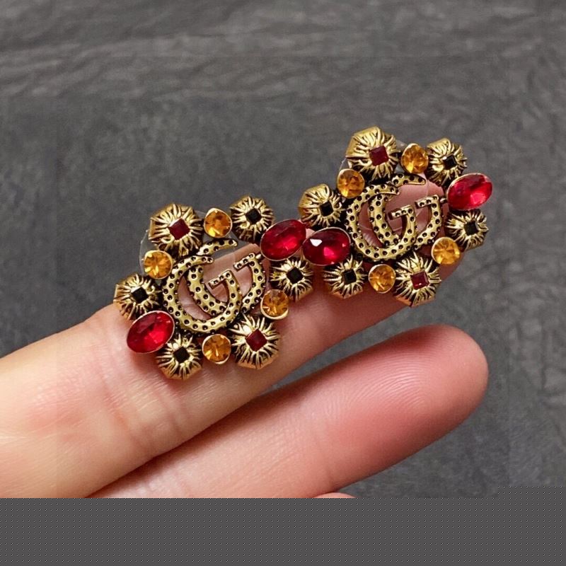 G*u*i earrings